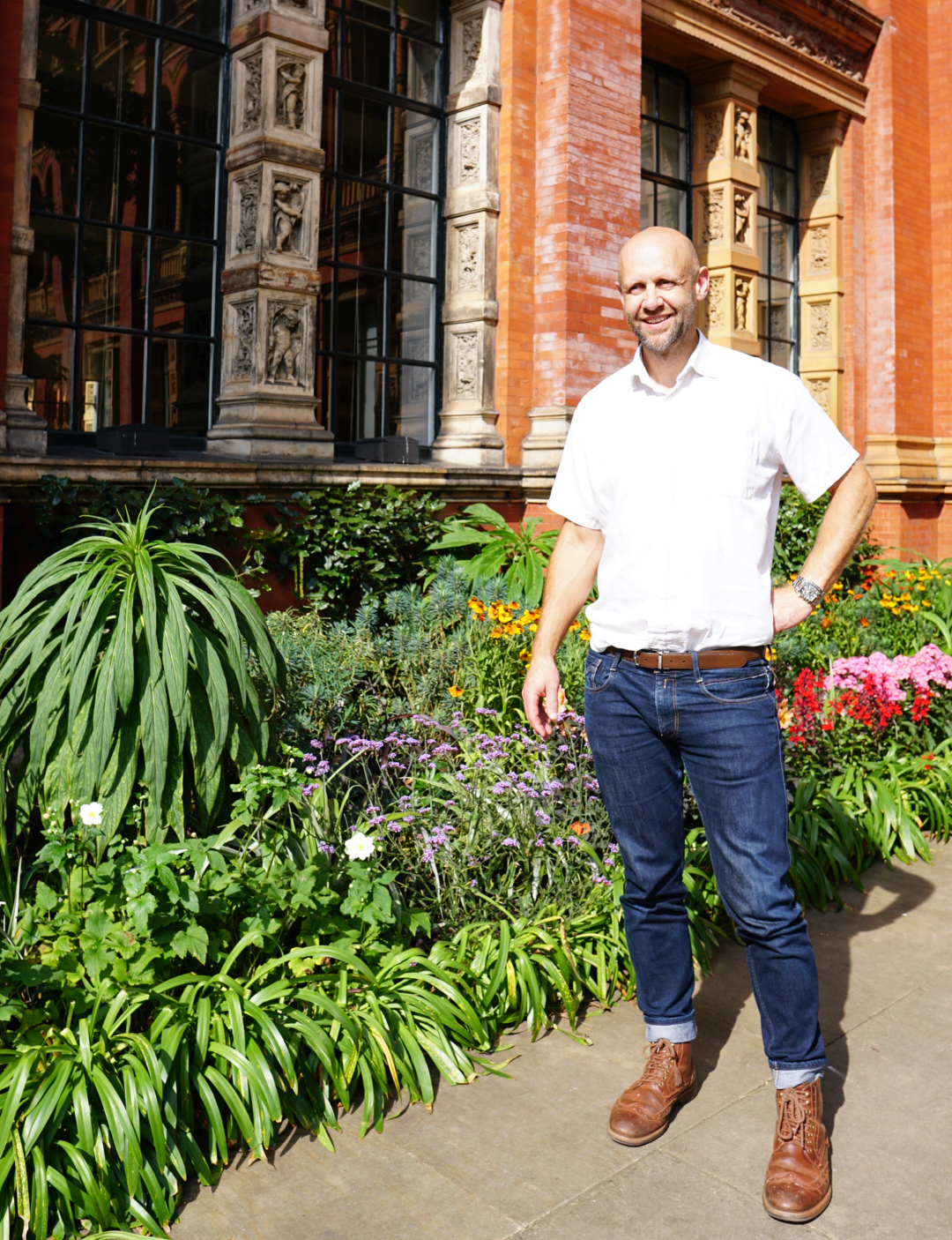 Ian Guyver the garden architect standing near flower border of the Victoria and Albert museum